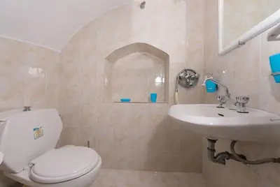 a bathroom with a toilet and a sink at Traditional 3 bedroom house in the Old Town in Rhodes Town