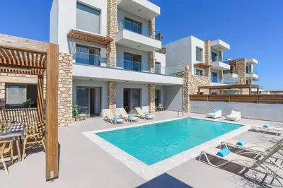 an image of a villa with a swimming pool at Villa Angelina Olivestone by Villa Plus in Yennadhion