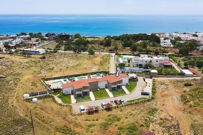 an aerial view of a house with the ocean at Villa Alcyone Seastone by Villa Plus in Kiotari