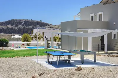 a ping pong table in front of a house at Villa Alexia by Villa Plus in Pefki Rhodes