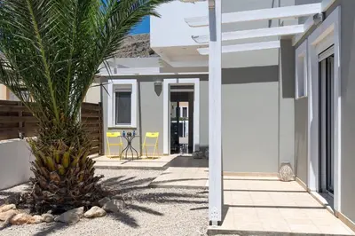 a palm tree in front of a building at Villa Alexia by Villa Plus in Pefki Rhodes