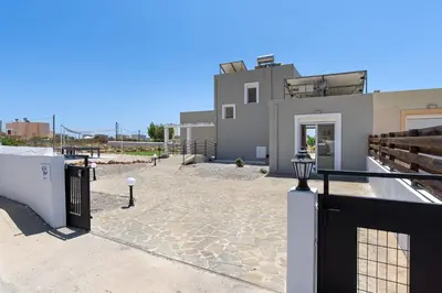 a house with a gate in front of it at Villa Alexia by Villa Plus in Pefki Rhodes