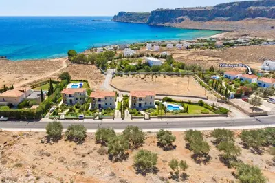 an aerial view of a resort near the ocean at Villa Aqua Blu by Villa Plus in Líndos