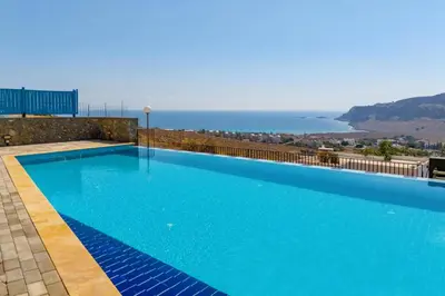 a swimming pool with a view of the ocean at Villa Castello by Villa Plus in Líndos