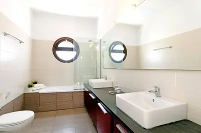 a white bathroom with a sink and a toilet at Villa Despina by Villa Plus in Pefki Rhodes