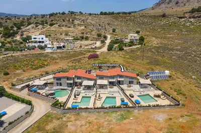 an aerial view of a house with a swimming pool at Villa Dione Seastone by Villa Plus in Kiotari