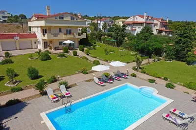 an aerial view of a house with a swimming pool at Villa Helios Rodos by Villa Plus in Asgourou