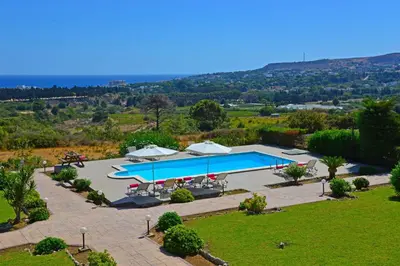 an overhead view of a swimming pool in a park at Villa Helios Rodos by Villa Plus in Asgourou