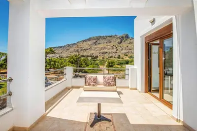 a balcony with a view of a mountain at Villa Maya by Villa Plus in Pefki Rhodes
