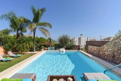 a swimming pool in the backyard of a villa at Villa Selini by Villa Plus in Pefki Rhodes
