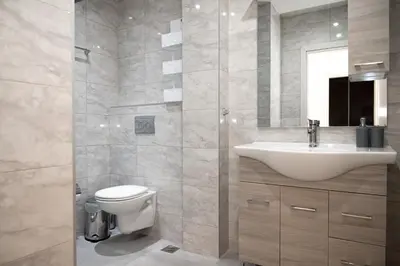 a bathroom with a sink and a toilet and a mirror at Asterashouse in Rhodes Town