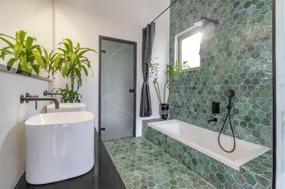 a bathroom with a tub and a sink and a shower at Villa Gaia Green-Adults only in Kolimbia