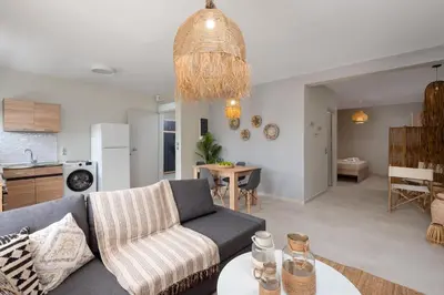 a living room with a couch and a table at Port Living Apartments in Rhodes Town