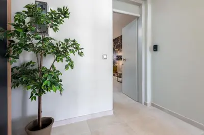 a plant in a pot in a hallway at Port Living Apartments in Rhodes Town