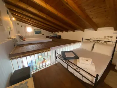 an overhead view of a room with a couch and a bed at Kleopatra Sweet Home in Symi