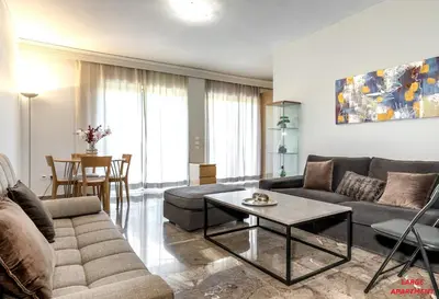 a living room with a couch and a table at Rhodes Heart Apartments close to the old town in Rhodes Town