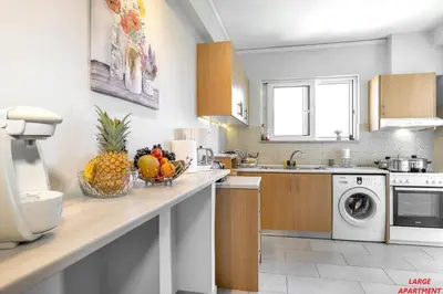 a kitchen with a bowl of fruit on a counter at Rhodes Heart Apartments close to the old town in Rhodes Town