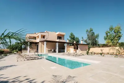 a villa with a swimming pool and a house at Villa Maribia with Private pool in Gennadi