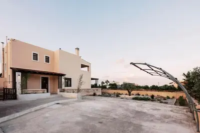 a house with a driveway in front of it at Villa Maribia with Private pool in Gennadi