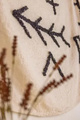 a close up of the writing on the side of a shirt at Peni sol Superior Studios Lindos in Líndos