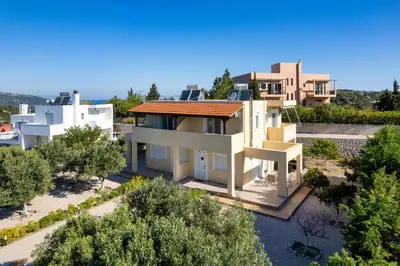 an aerial view of a house with trees at Sunny Garden Apartments in Pastida