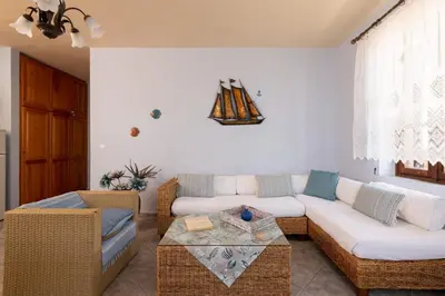 a living room with a couch and a table at Villa Leleka in Halki