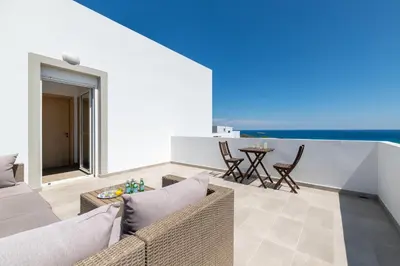 a living room with a couch and a table at Villa Melodia, 4 Bedroom Villa with Private Pool in Líndos