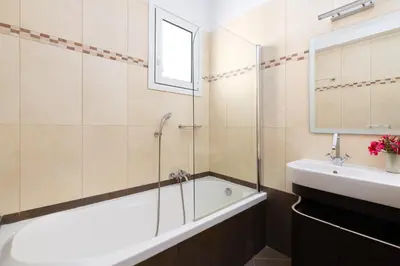 a bathroom with a bath tub and a sink at Villa Melodia, 4 Bedroom Villa with Private Pool in Líndos