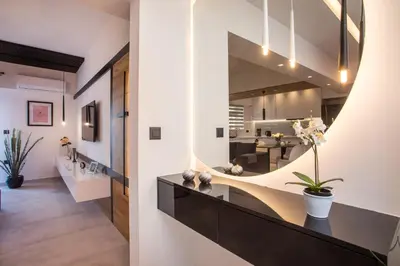 a living room with a large mirror on the wall at Rhodes Diamond luxury flat in the heart of town in Rhodes Town