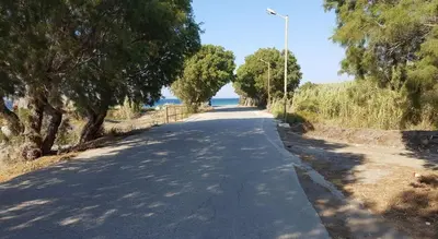 an empty road with trees on the side of the road at Smart Accommodation Rhodes in Rhodes Town