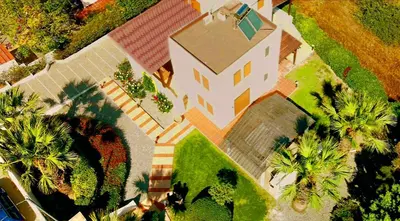 an overhead view of a large house with palm trees at Tramonto Blue in Gennadi