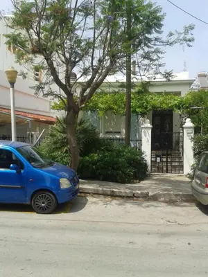 a blue car parked in front of a house at House with garden in city of Rhodes in Rhodes Town