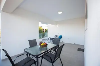 a dining room with a table and chairs at My Home in RHO in Koskinou