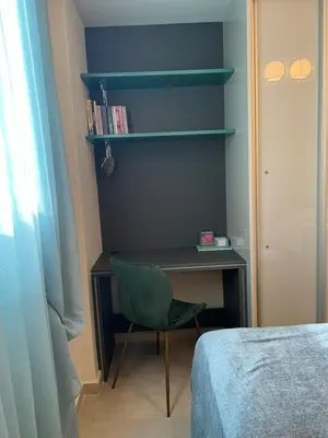 a bedroom with a desk and a chair next to a bed at Psaropoula's Hidden Gem in Rhodes Town