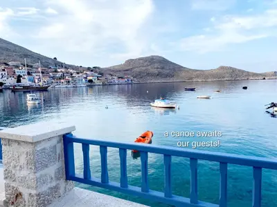 a view of a harbor with boats in the water at Halki Sea Breeze - a waterfront villa in Halki
