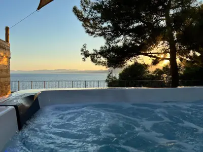 a hot tub with a view of the ocean at Kavos beach house in Pefki Rhodes