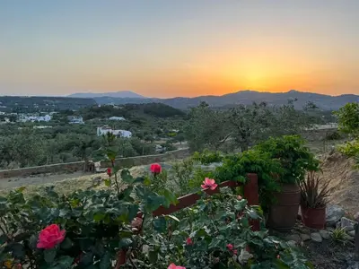a view of the sunset from a garden at Rhodes traditional Cottage with private garden in Archangelos