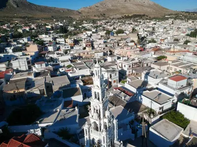an aerial view of a city with mountains in the background at Rhodes traditional Cottage with private garden in Archangelos