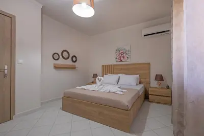 a bedroom with a large bed in a room at Casa di Gianna in Rhodes Town