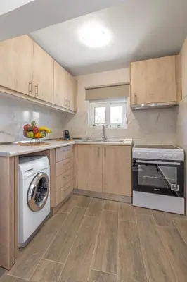 a kitchen with a dishwasher and a washer and sink at Casa di Gianna in Rhodes Town