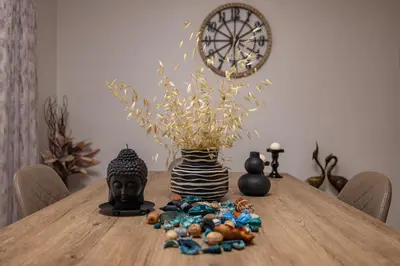 a wooden table with a vase and a pile of beads at Casa di Gianna in Rhodes Town