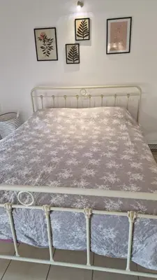 a bed in a room with a white bed frame at Cosy little studio for family vacations ! in Rhodes Town