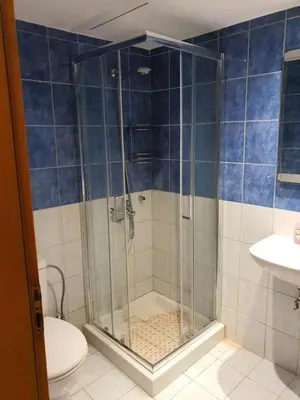 a bathroom with a shower and a toilet at Cosy little studio for family vacations ! in Rhodes Town