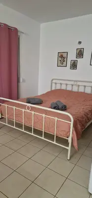 a bed in a bedroom with at Cosy little studio for family vacations ! in Rhodes Town