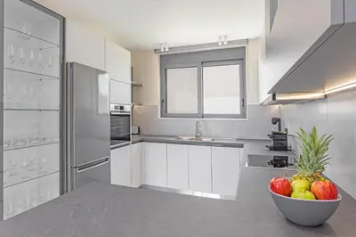 a kitchen with a bowl of fruit on a counter at Mont Fleury Resort in Koskinou