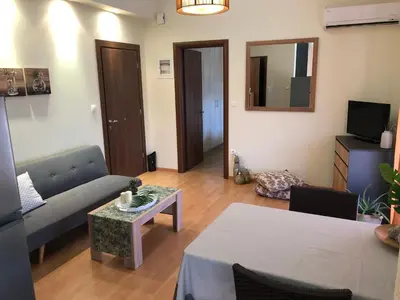 a living room with a couch and a table at MATREL Home 2 in Rhodes Town
