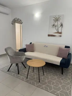 a living room with a couch and a table at Deda Apartments in Livadia