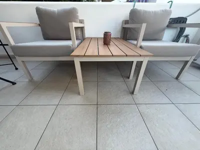 a coffee table in front of a couch and a table at Deda Apartments in Livadia