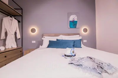a bedroom with a bed with a towel on it at Ialemos Group in Symi