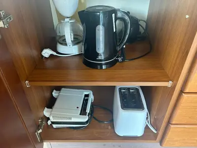 a coffee maker and a blender on a shelf at Villa Poseidon Blue in Rhodes Town